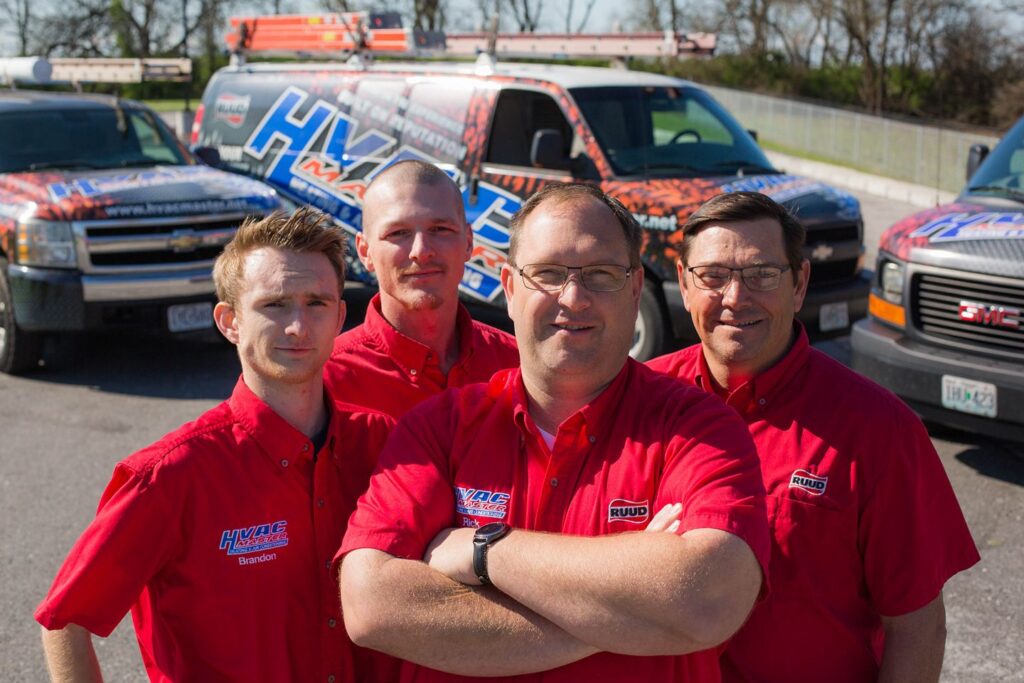 HVAC Master Heating & Air Conditioning LLC technician servicing residential air conditioning unit outdoors