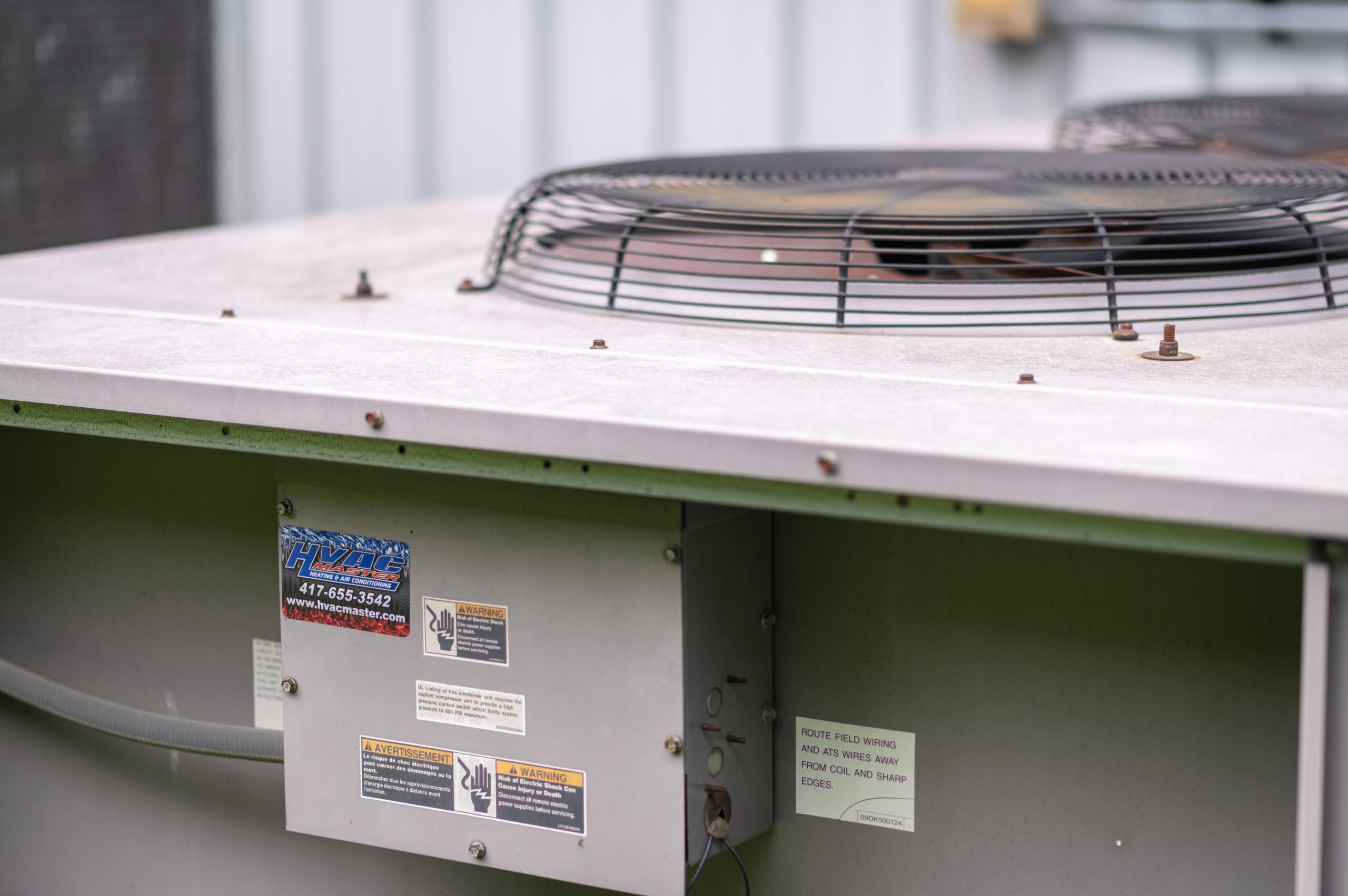 HVAC technician from HVAC Master Heating & Air Conditioning LLC servicing residential outdoor AC condenser